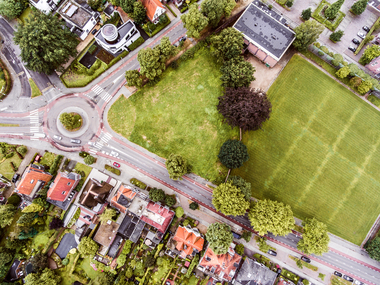 Aerial view of dutch town private houses streets and roundabout green park with trees sbi 305222696